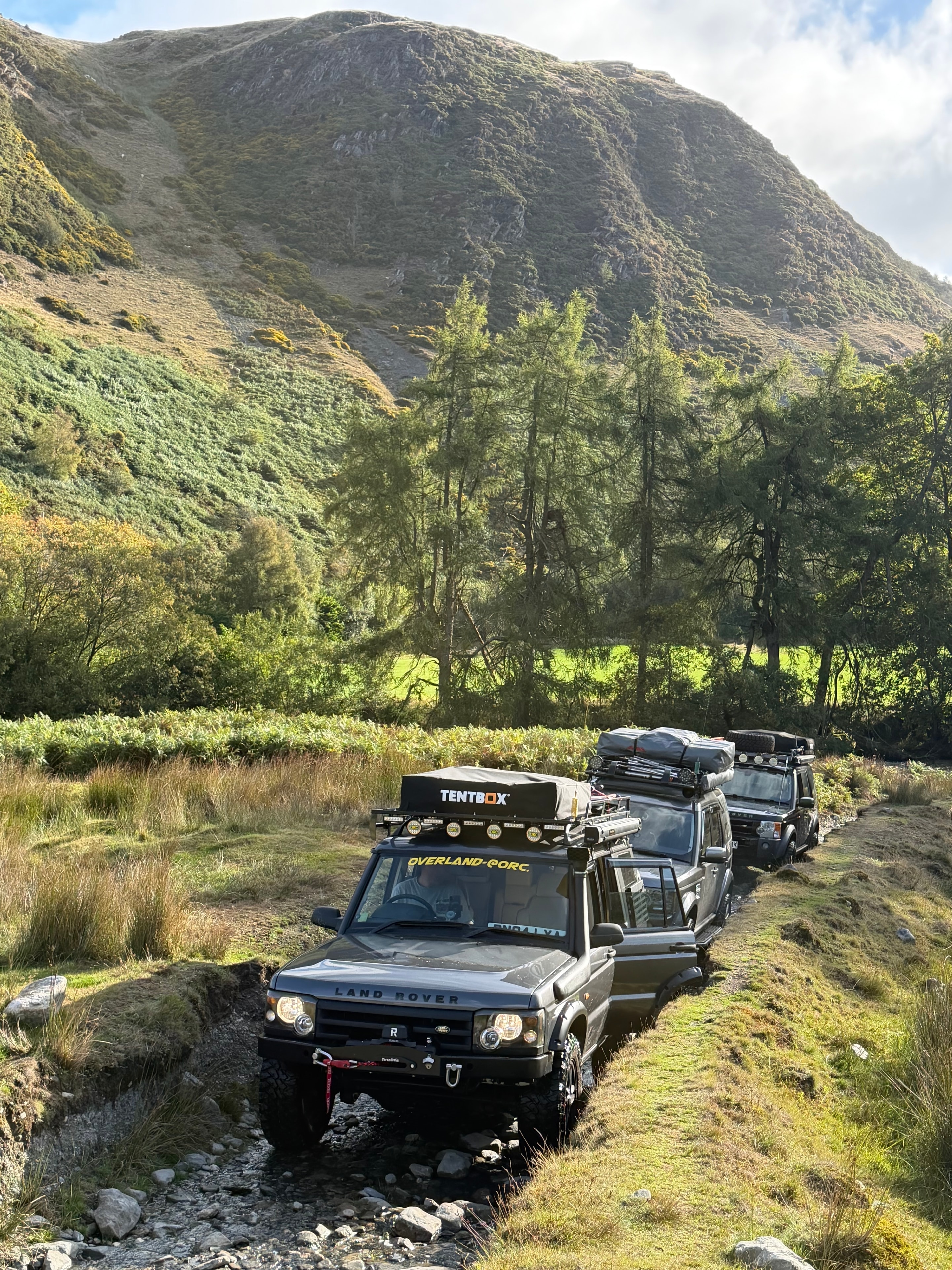 Land Rovers in convoy on a Welsh off-road trail
